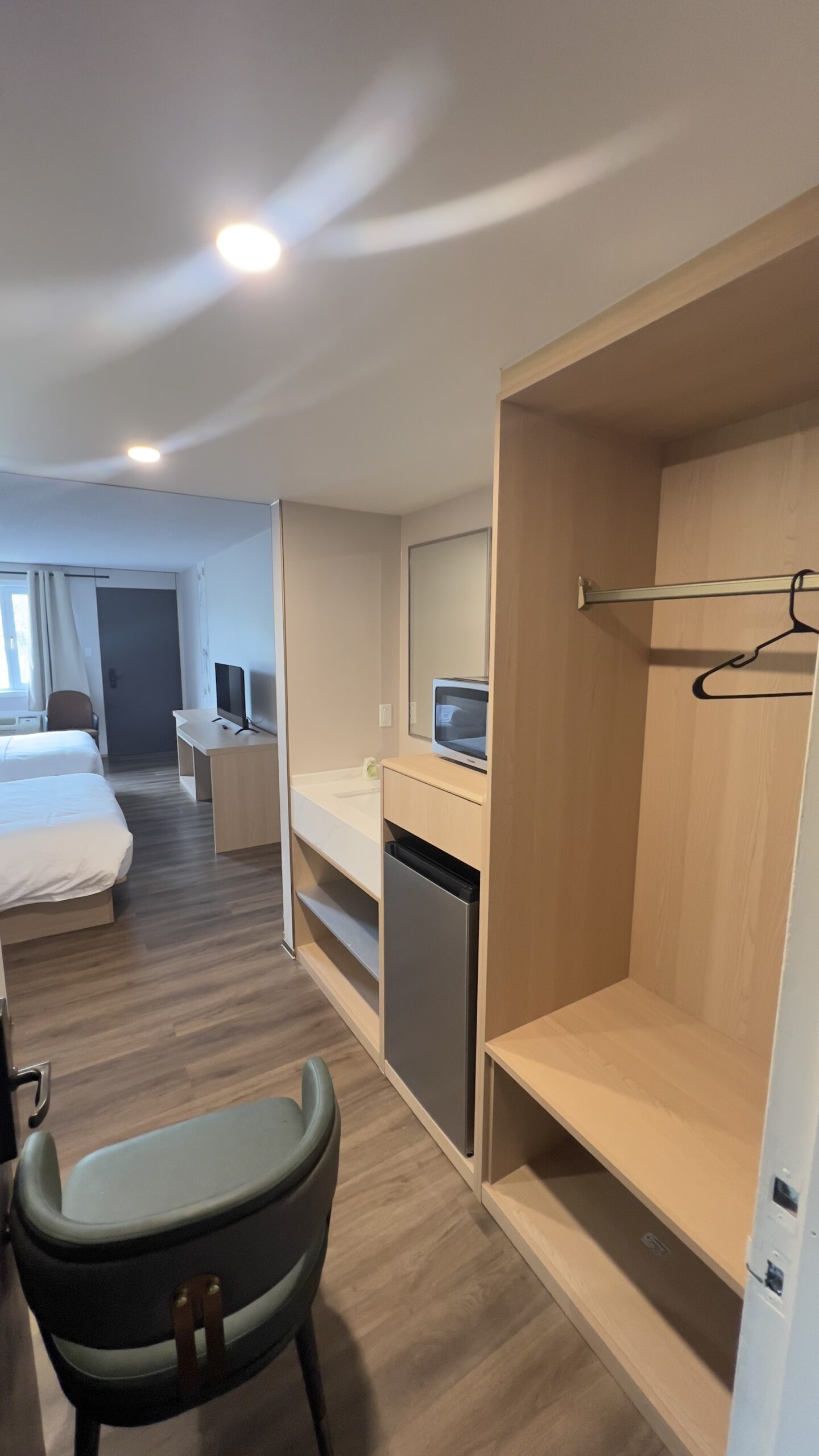 Installed wardrobe, desk and storage in a hotel guest room